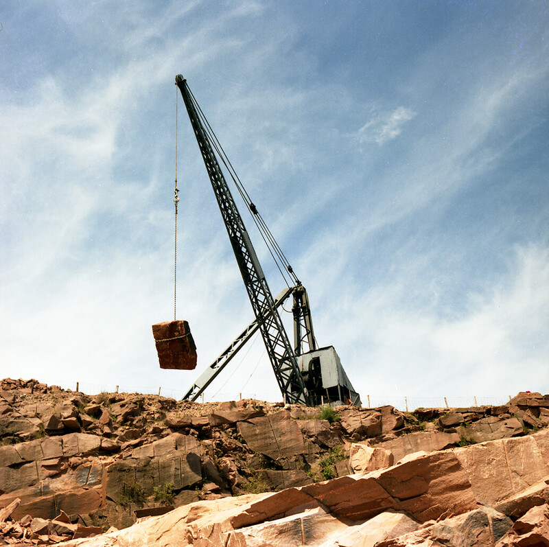 A sandstone block being winched from a quarry of the Locharbriggs Cluster; photographed in 1984.
