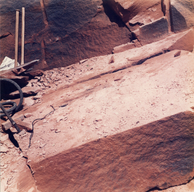 The worked face in a quarry of the Locharbriggs Cluster, photographed in 1984. A sandstone block has been split along the joint plane, ready for removal.